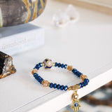 Blue & Peach Glass Beaded Bracelet w Evil Eye PendantJ.GainoBracelet