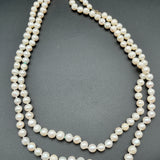 Opera length white pearls