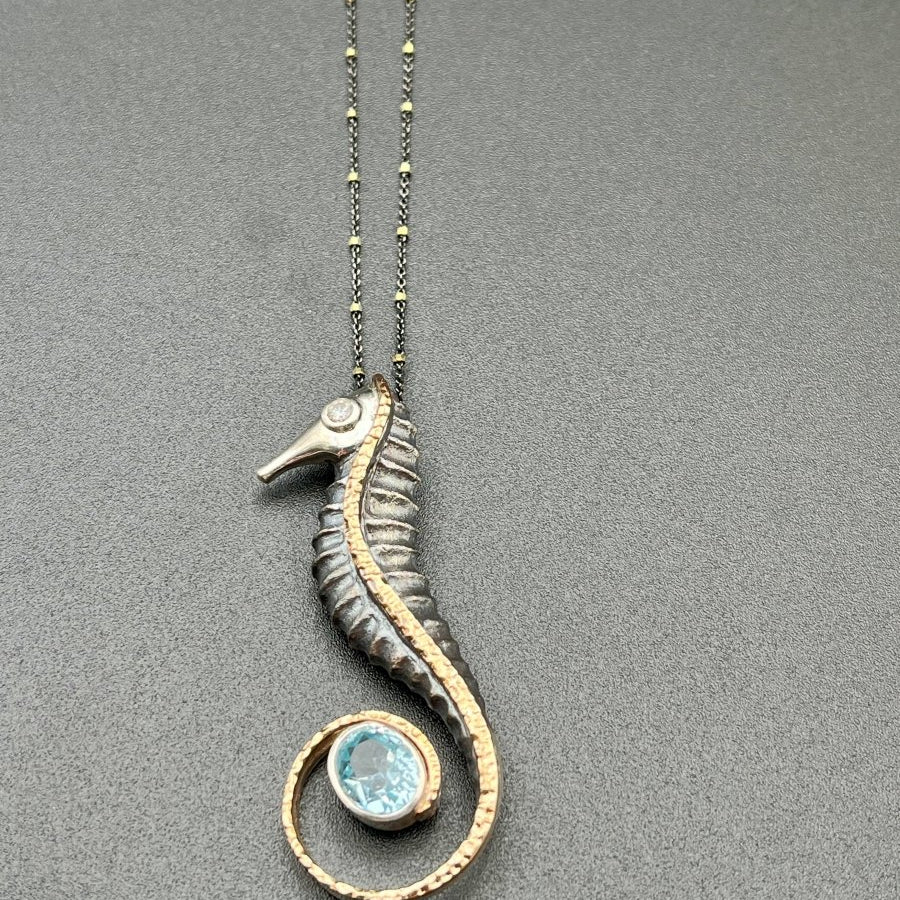 Blue Topaz in a Seahorse Tail NecklaceBORANECKLACES