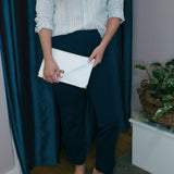 Leather clutch in whiteANA KOUTSIBAGS