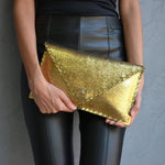 Sparkling clutch in goldANA KOUTSIBAGS