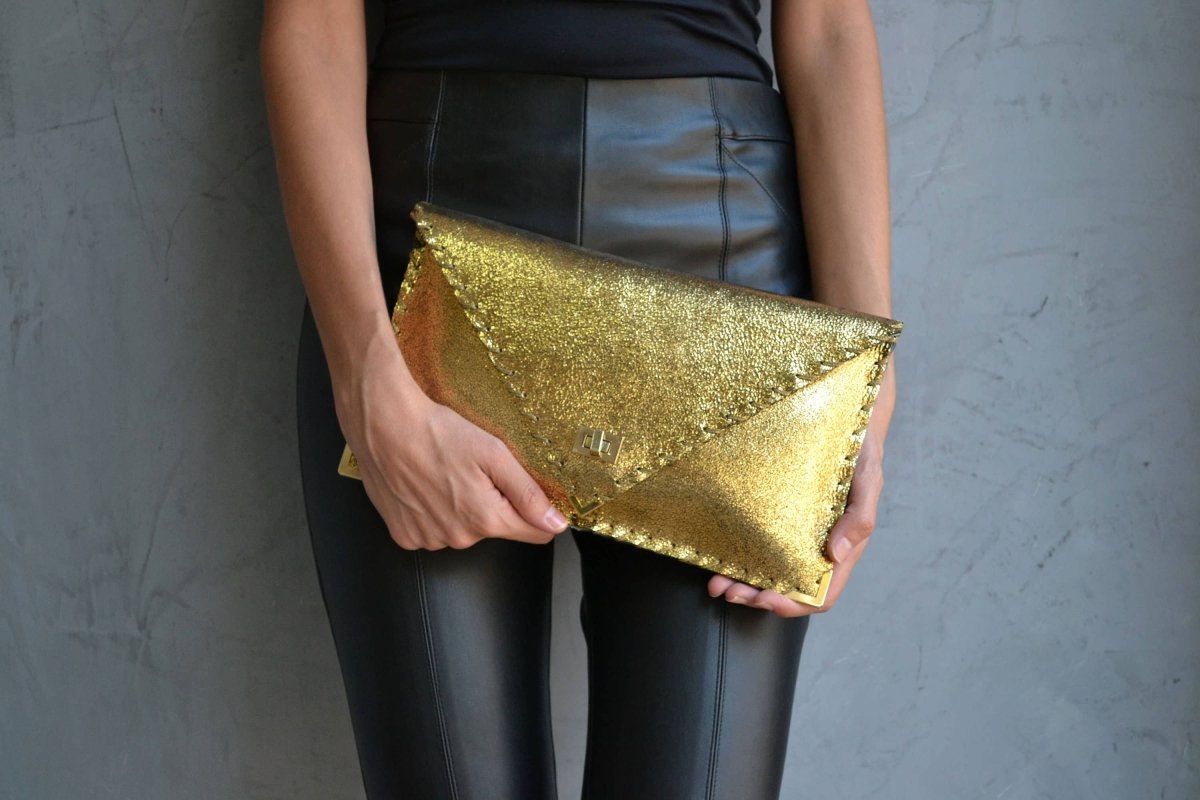 Sparkling clutch in goldANA KOUTSIBAGS