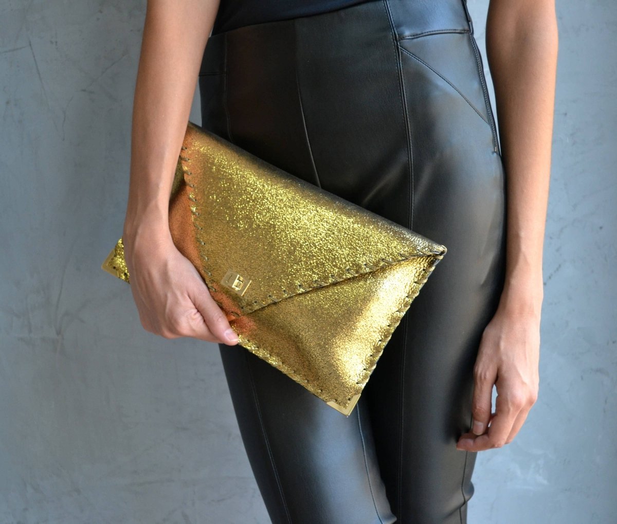 Sparkling clutch in goldANA KOUTSIBAGS