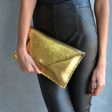 Sparkling clutch in goldANA KOUTSIBAGS