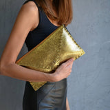 Sparkling clutch in goldANA KOUTSIBAGS