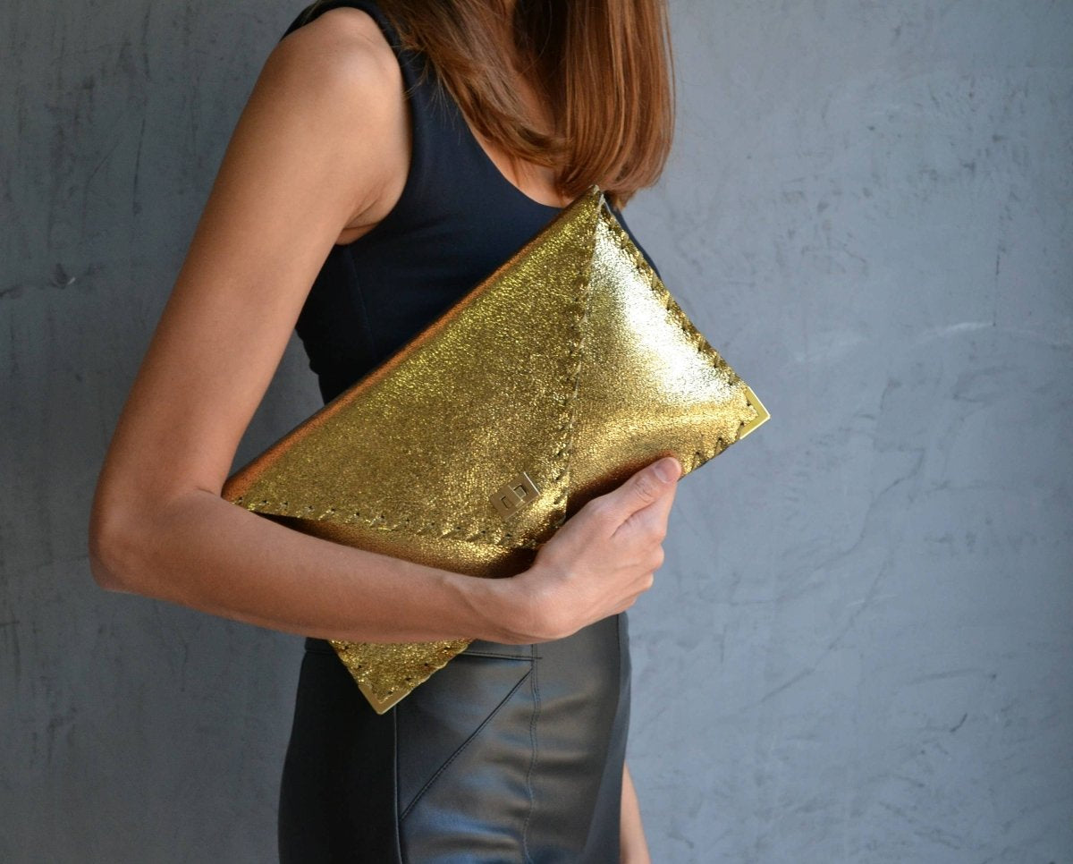 Sparkling clutch in goldANA KOUTSIBAGS