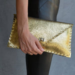 Sparkling clutch in goldANA KOUTSIBAGS