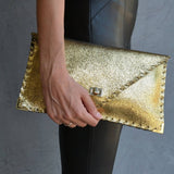 Sparkling clutch in goldANA KOUTSIBAGS