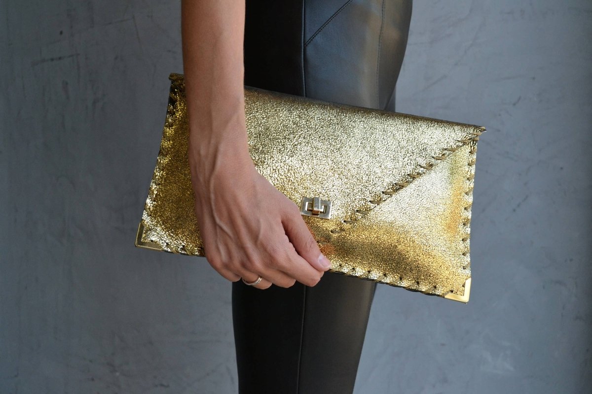 Sparkling clutch in goldANA KOUTSIBAGS