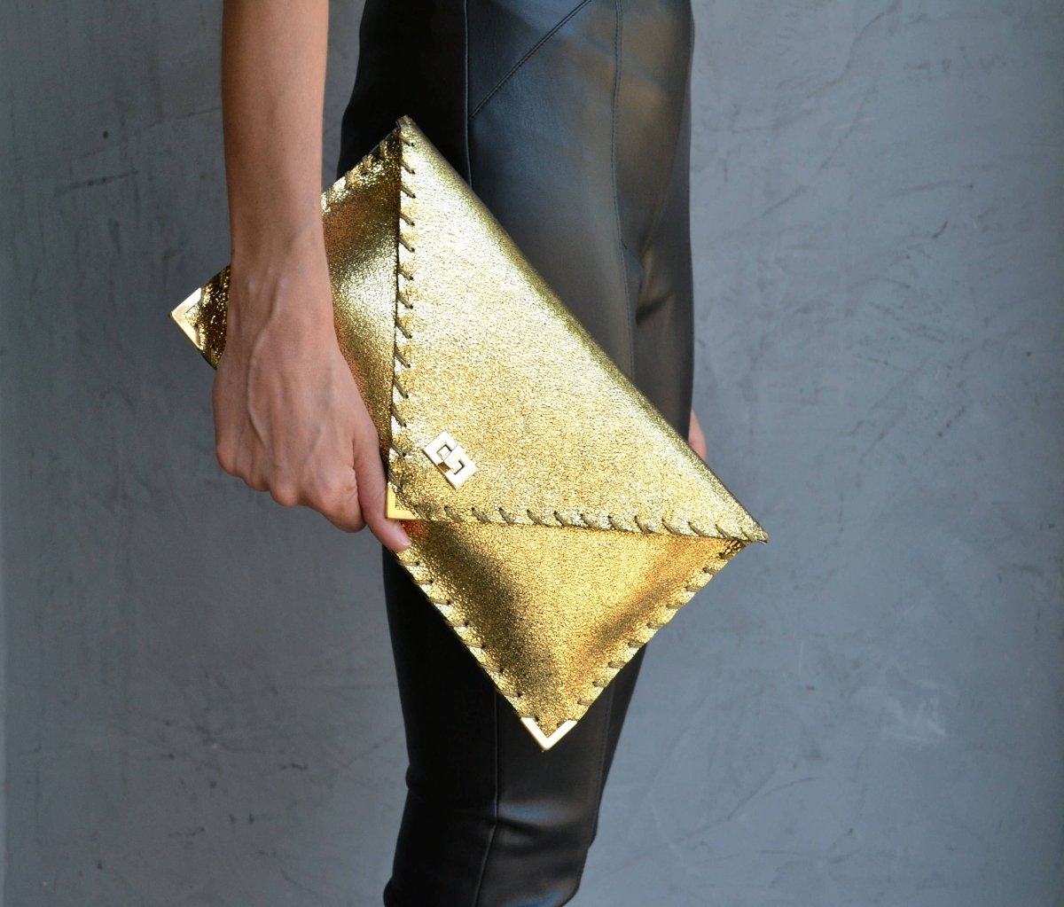 Sparkling clutch in goldANA KOUTSIBAGS