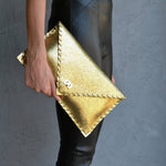 Sparkling clutch in goldANA KOUTSIBAGS