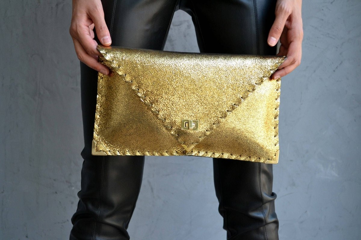 Sparkling clutch in goldANA KOUTSIBAGS