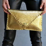 Sparkling clutch in goldANA KOUTSIBAGS
