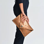 Sparkling leather clutch in bronzeANA KOUTSIBAGS