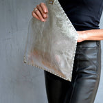 Symmetria leather clutch in silverANA KOUTSI