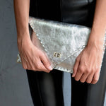Symmetria leather clutch in silverANA KOUTSI