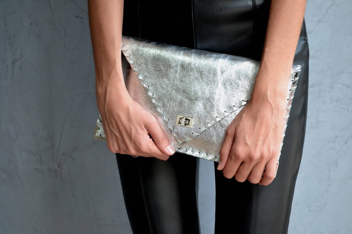 Symmetria leather clutch in silverANA KOUTSI