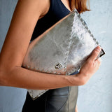 Symmetria leather clutch in silverANA KOUTSI