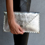 Symmetria leather clutch in silverANA KOUTSI