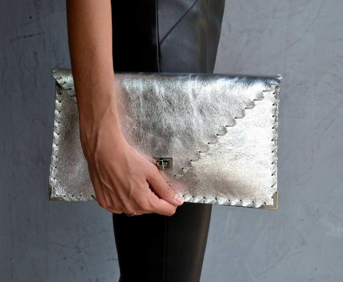 Symmetria leather clutch in silverANA KOUTSI